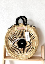 bolso de palma redondo con ojo bordado